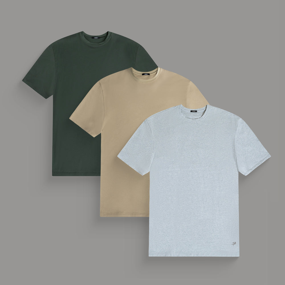 Three plain t-shirts in dark green, beige, and light gray, displayed on a gray background.