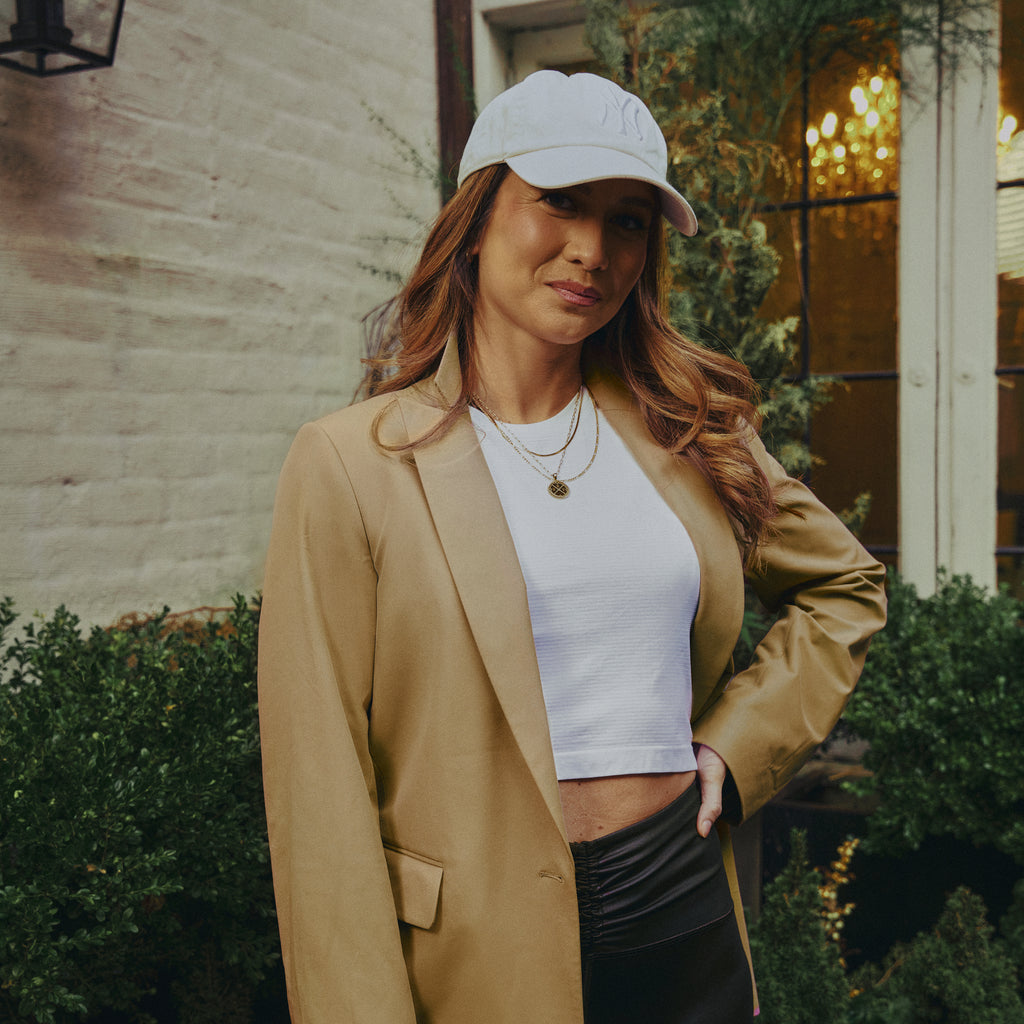 emma lovewell x sene peloton instructor model emma wearing flextech blazer in sand