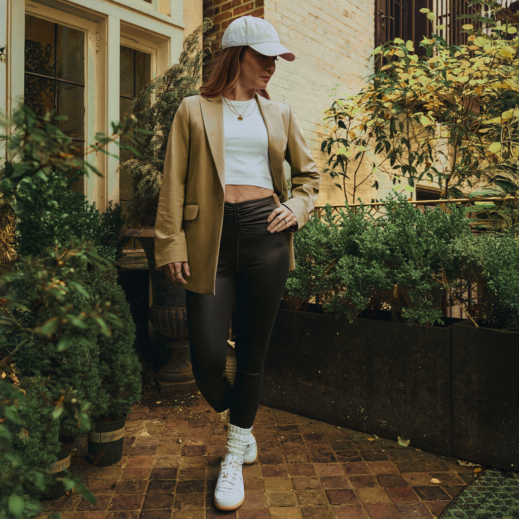 emma lovewell x sene peloton instructor model emma wearing flextech blazer in sand