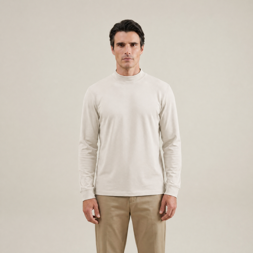 Man wearing a Bone long-sleeve shirt against a beige background model Kive in Bone