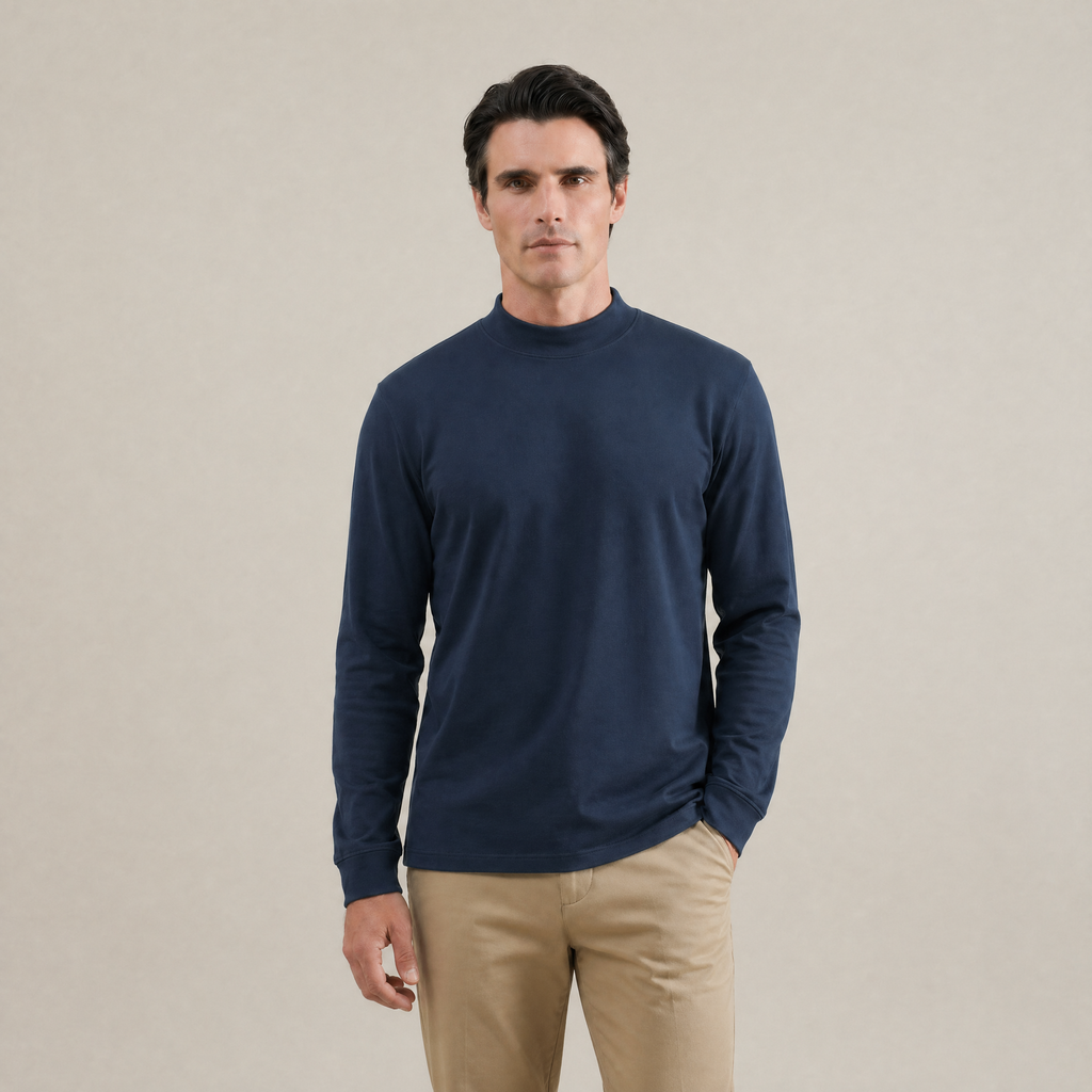 Man wearing a Deep Sea long-sleeve shirt against a beige background model Kive in Deep Sea