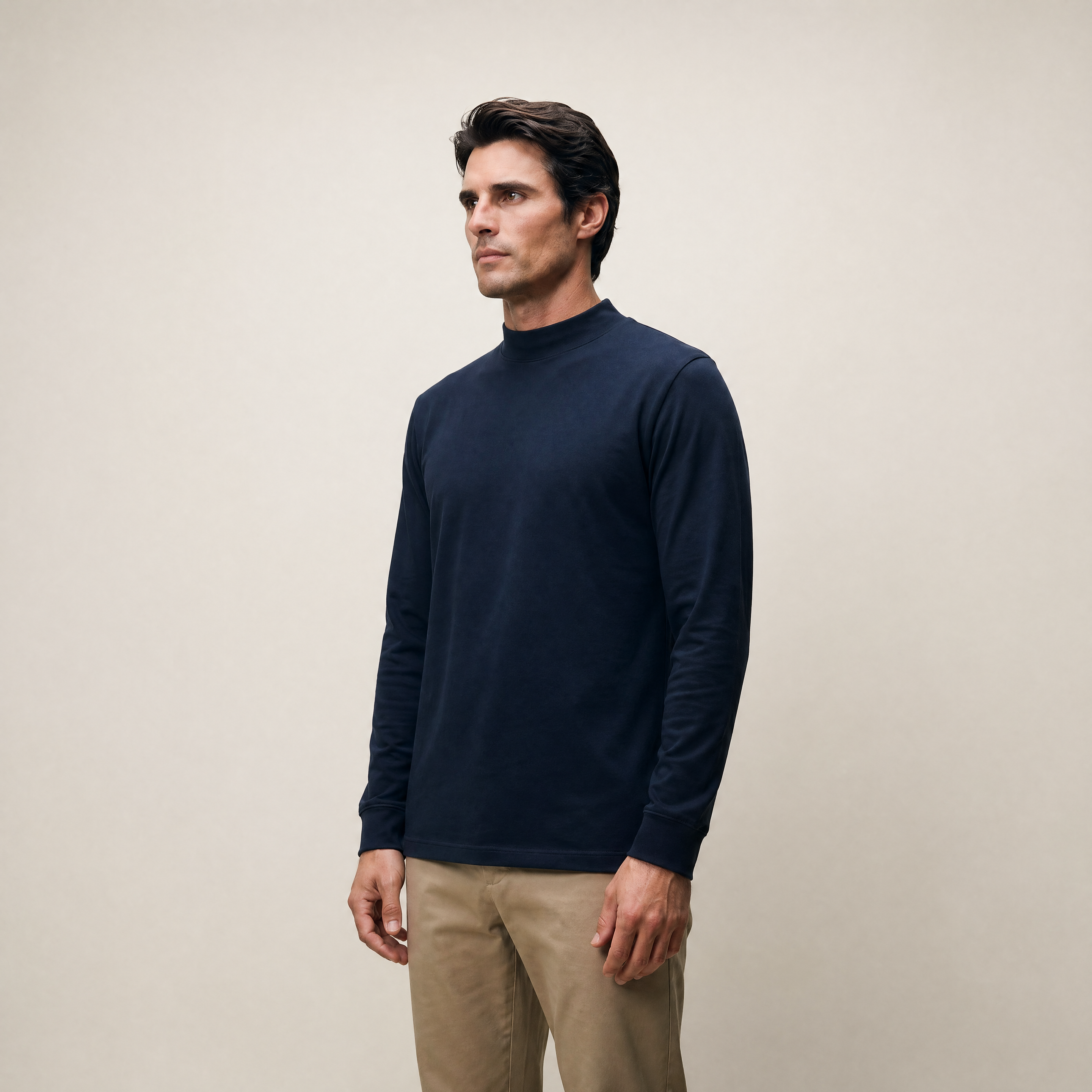 Man wearing a Deep Sea long-sleeve shirt against a beige background model Kive in Deep Sea