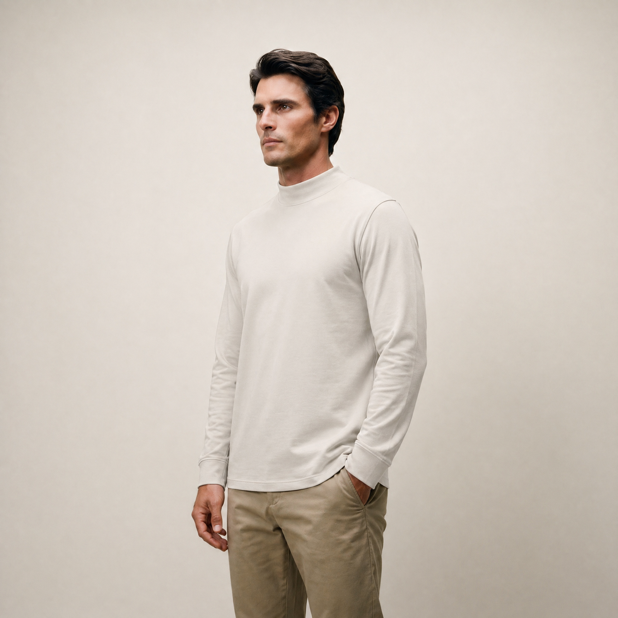 Man wearing a Bone long-sleeve shirt against a beige background model Kive in Bone