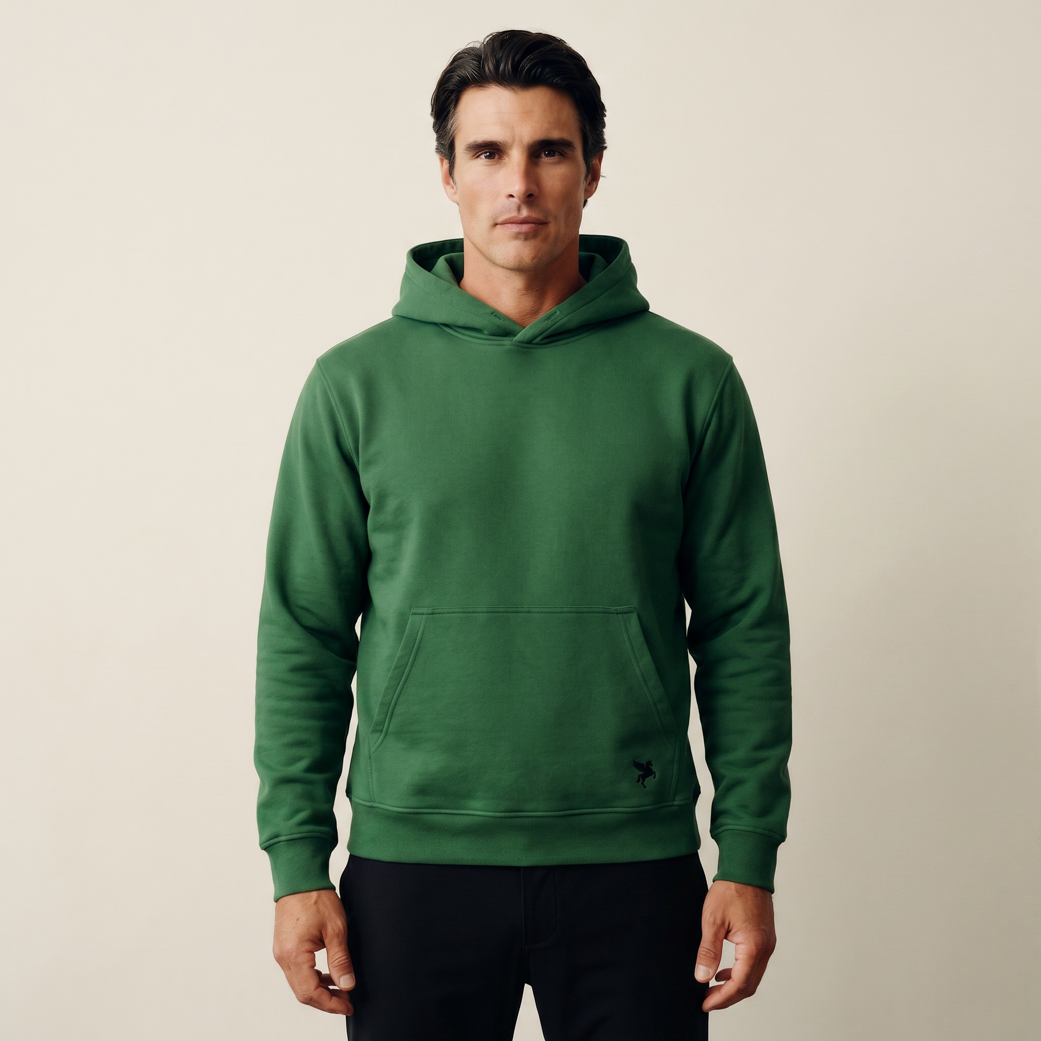 Man wearing a green hoodie on a beige background Green hoodie on a beige background Man wearing a green hoodie against a beige background model Kive in Eden