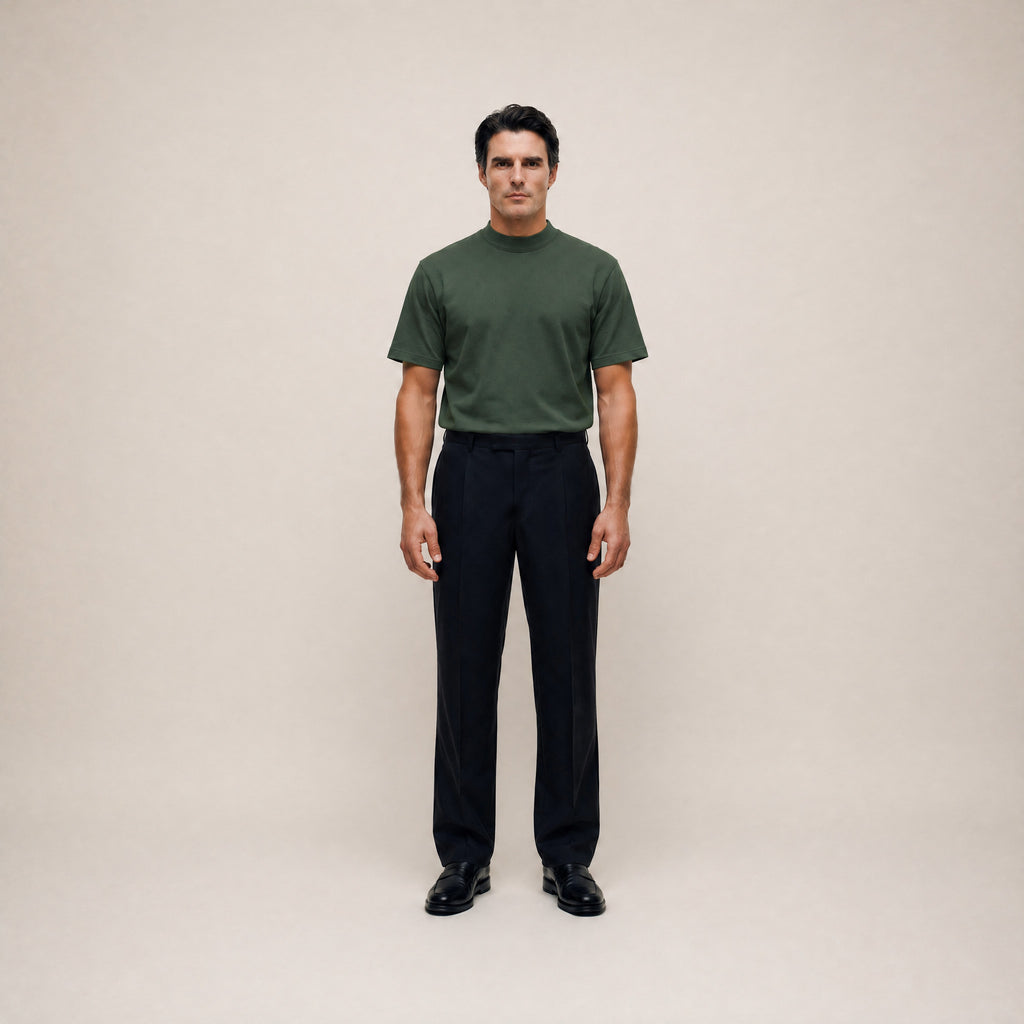 Man wearing a Moss short-sleeve shirt against a beige background model Kive in Moss