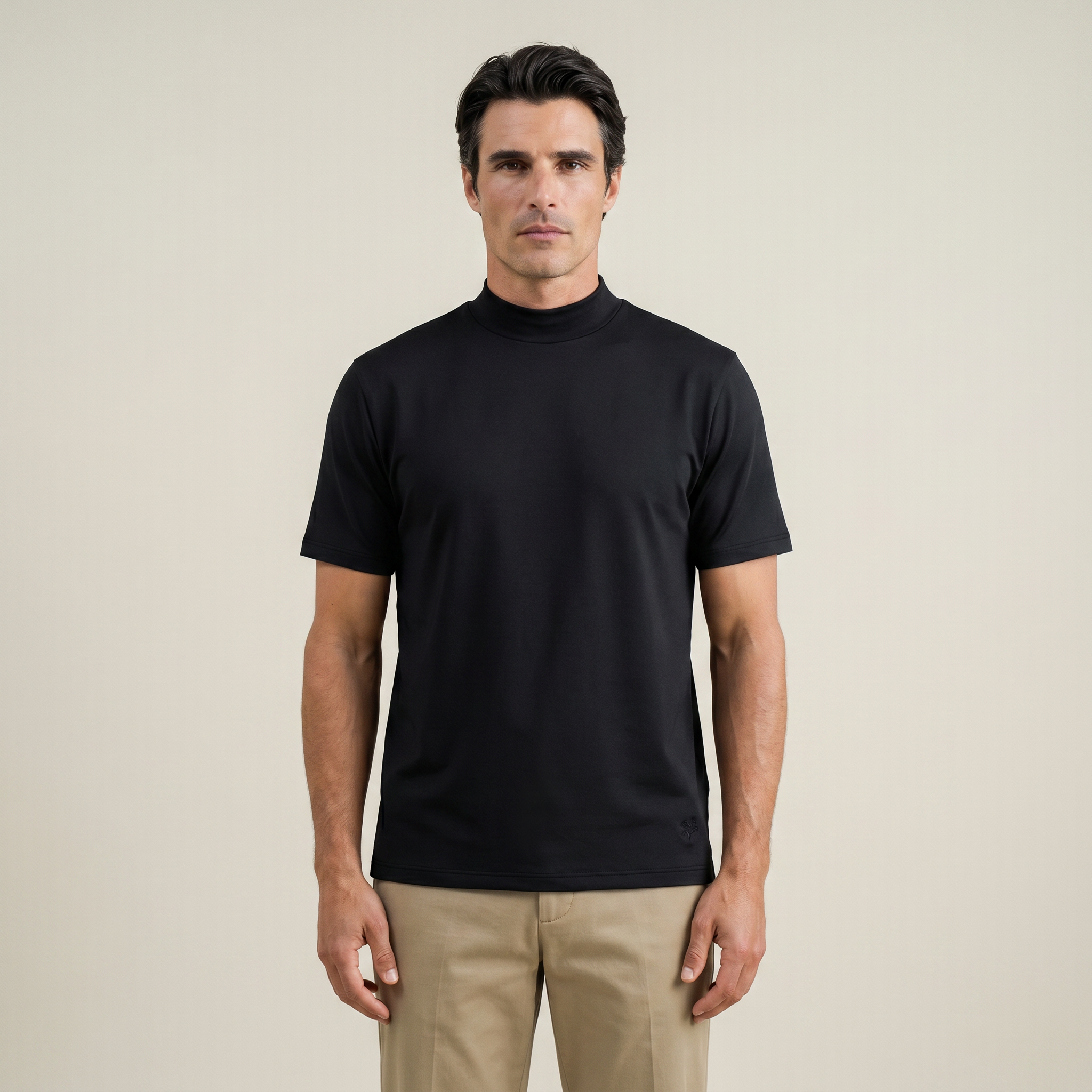 Man wearing a black short-sleeve shirt against a beige background model Kive in black