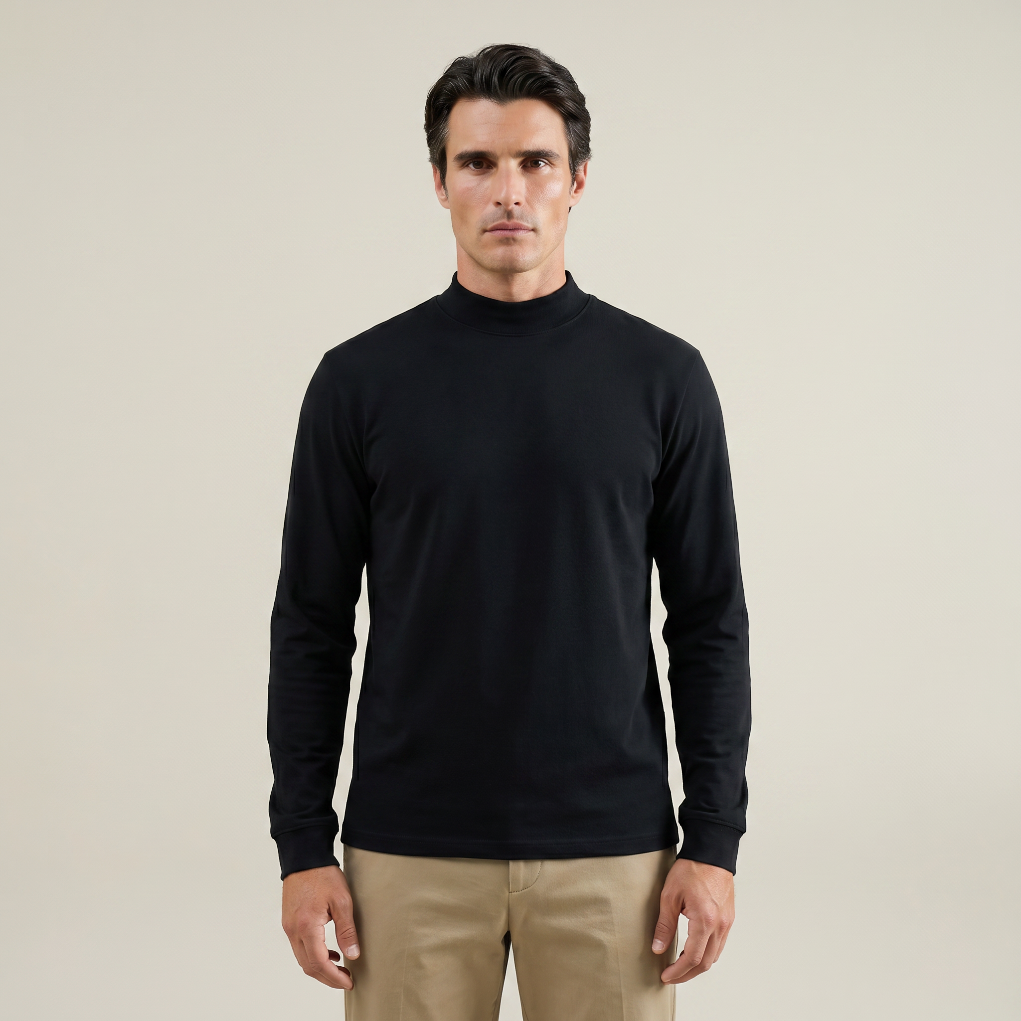Man wearing a black long-sleeve shirt against a beige background model Kive in black