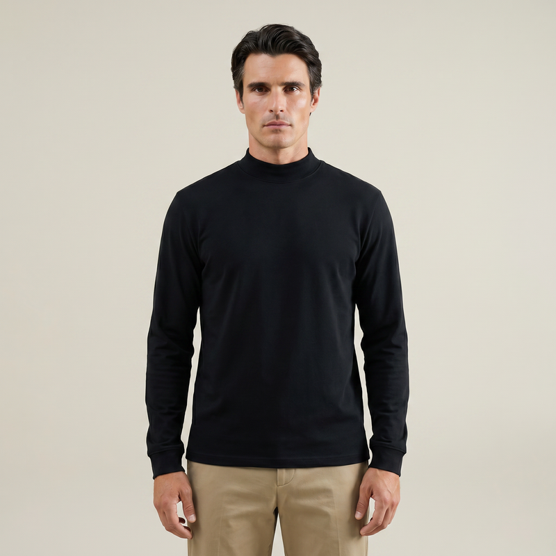 Man wearing a black long-sleeve shirt against a beige background model Kive in black