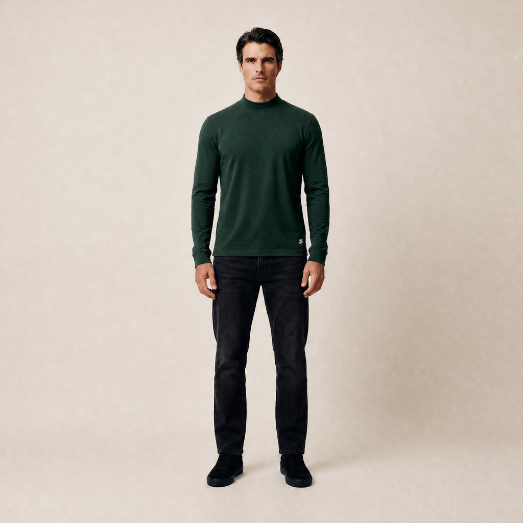 Man wearing a Pine Grove long-sleeve shirt against a beige background model Kive in Pine Grove