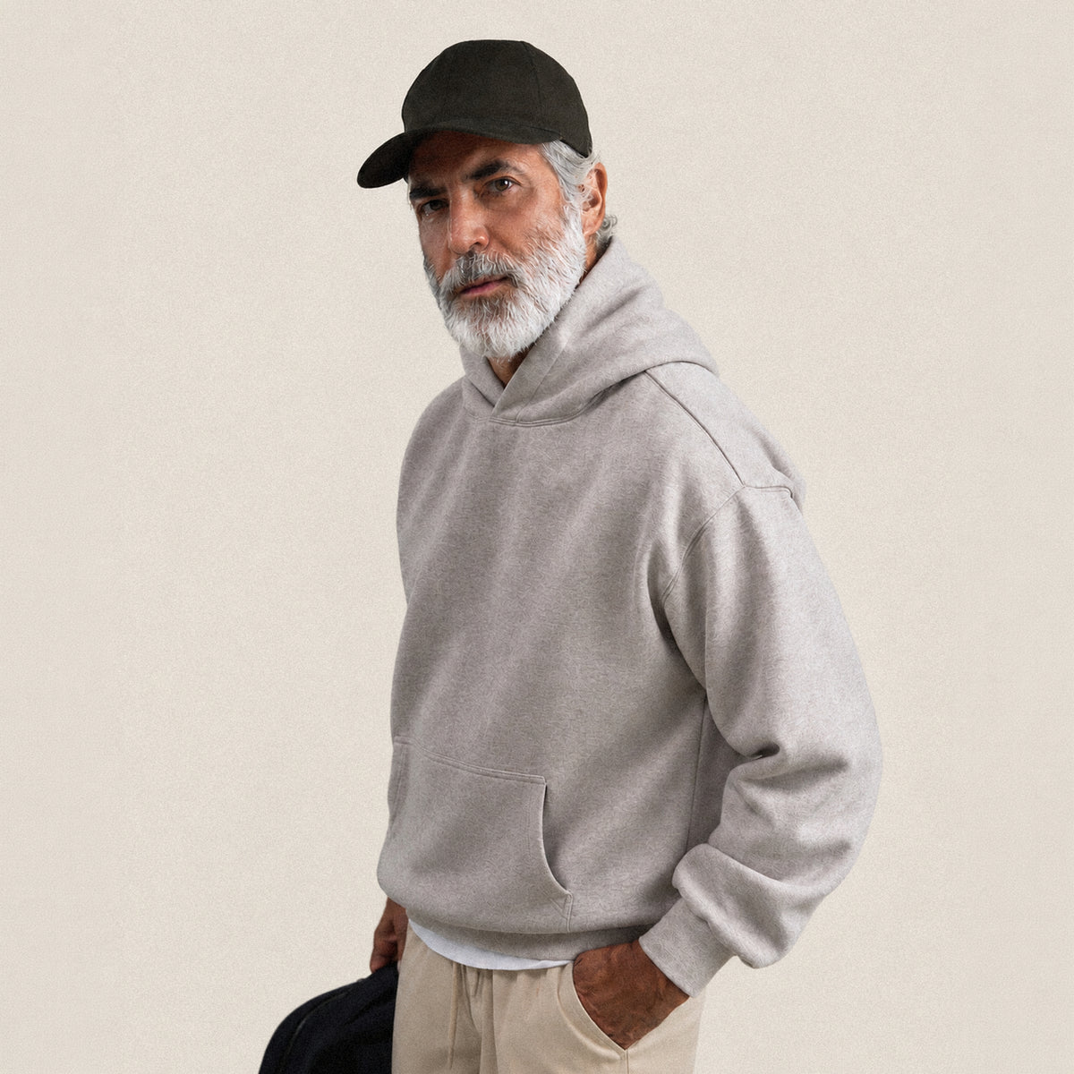 Heavyweight Terry Standard Hoodie model Guillermo in Heather Stone