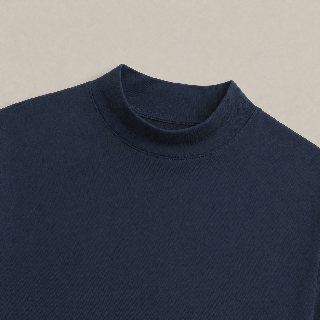 Close up of Deep Sea mockneck long-sleeve shirt in Deep Sea with beige background model Kive in Deep Sea