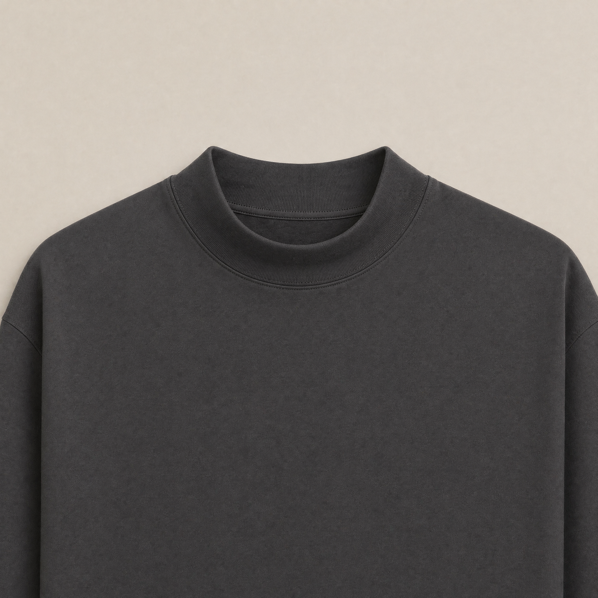 Close up of Smoke long-sleeve shirt flatlay against a beige background model Kive in Smoke