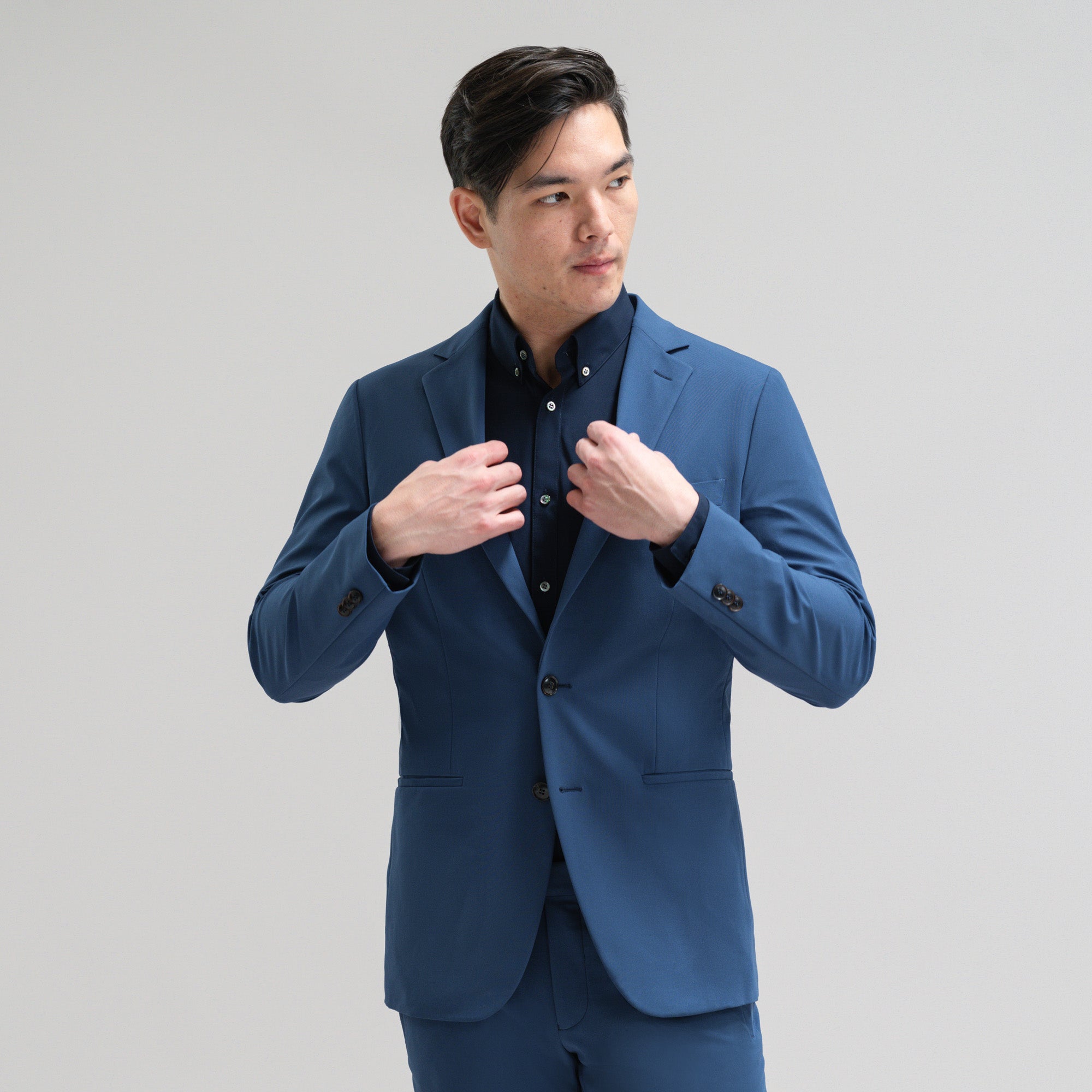 Bespoke custom athleisure technical athletic stretch suit los angeles model Jesse in Italian Blue