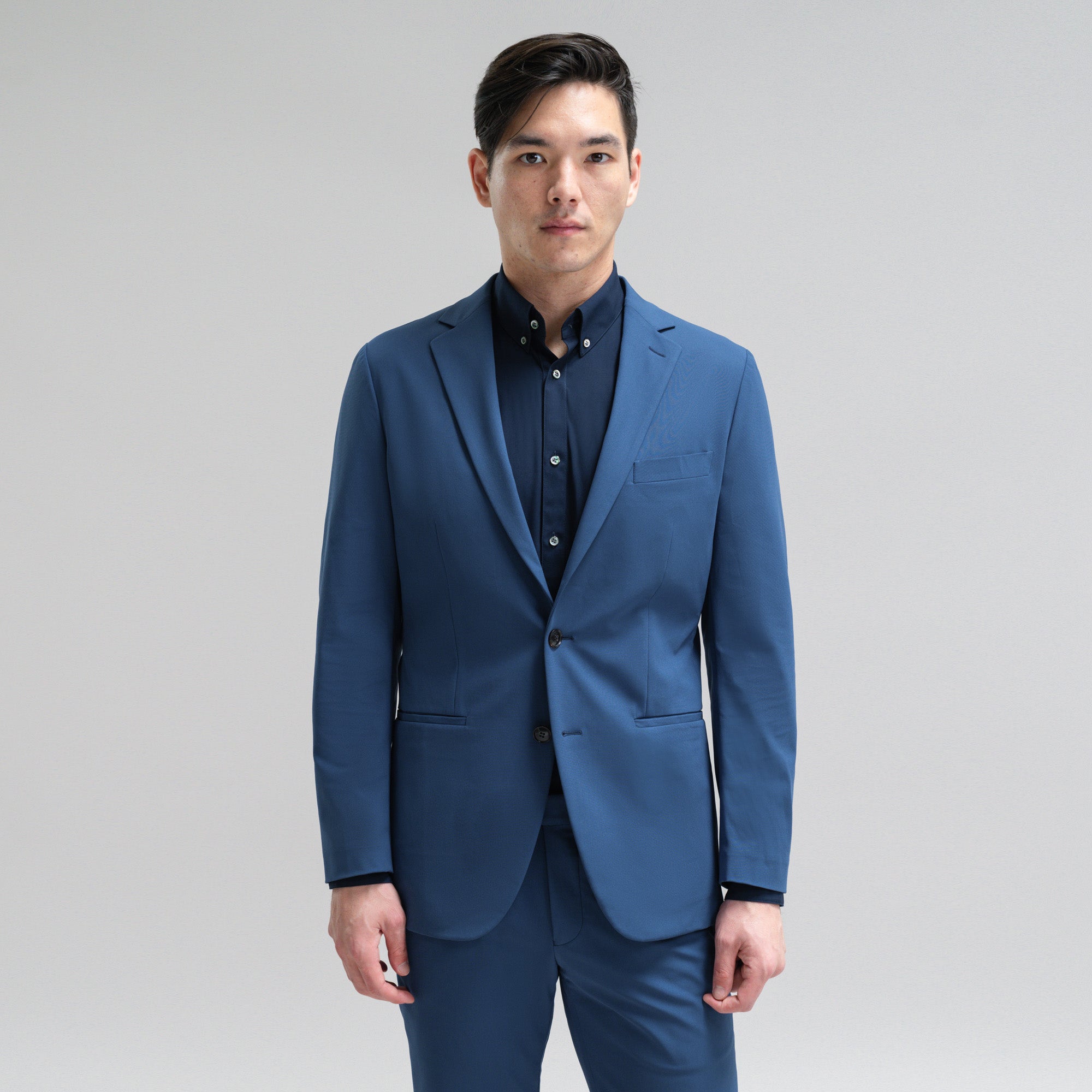 Bespoke custom athleisure technical athletic stretch suit los angeles model Jesse in Italian Blue