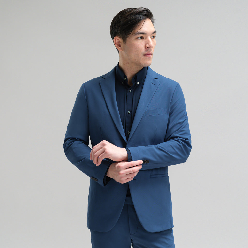 Bespoke custom athleisure technical athletic stretch suit los angeles model Jesse in Italian Blue