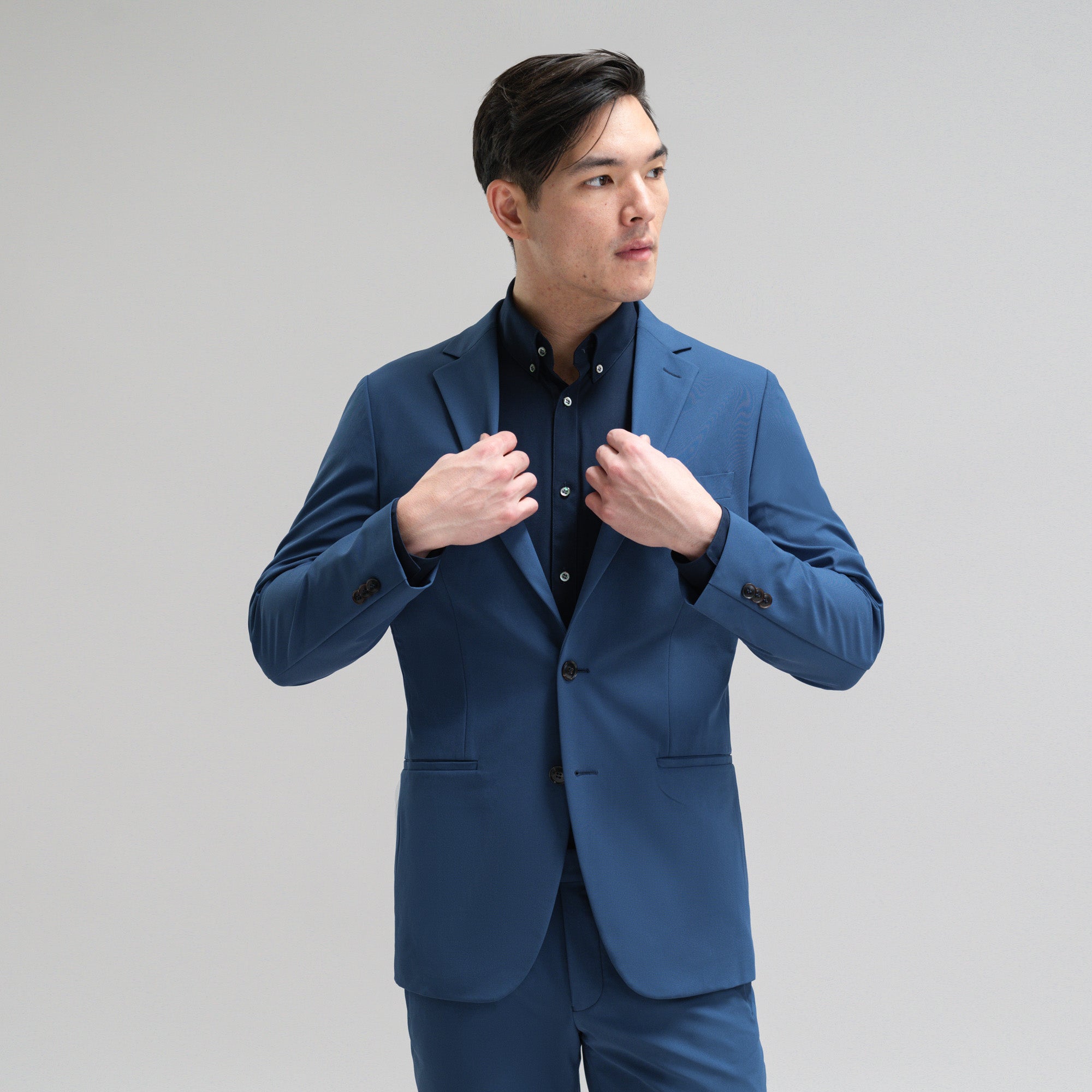Bespoke custom athleisure technical athletic stretch suit los angeles model Jesse in Italian Blue