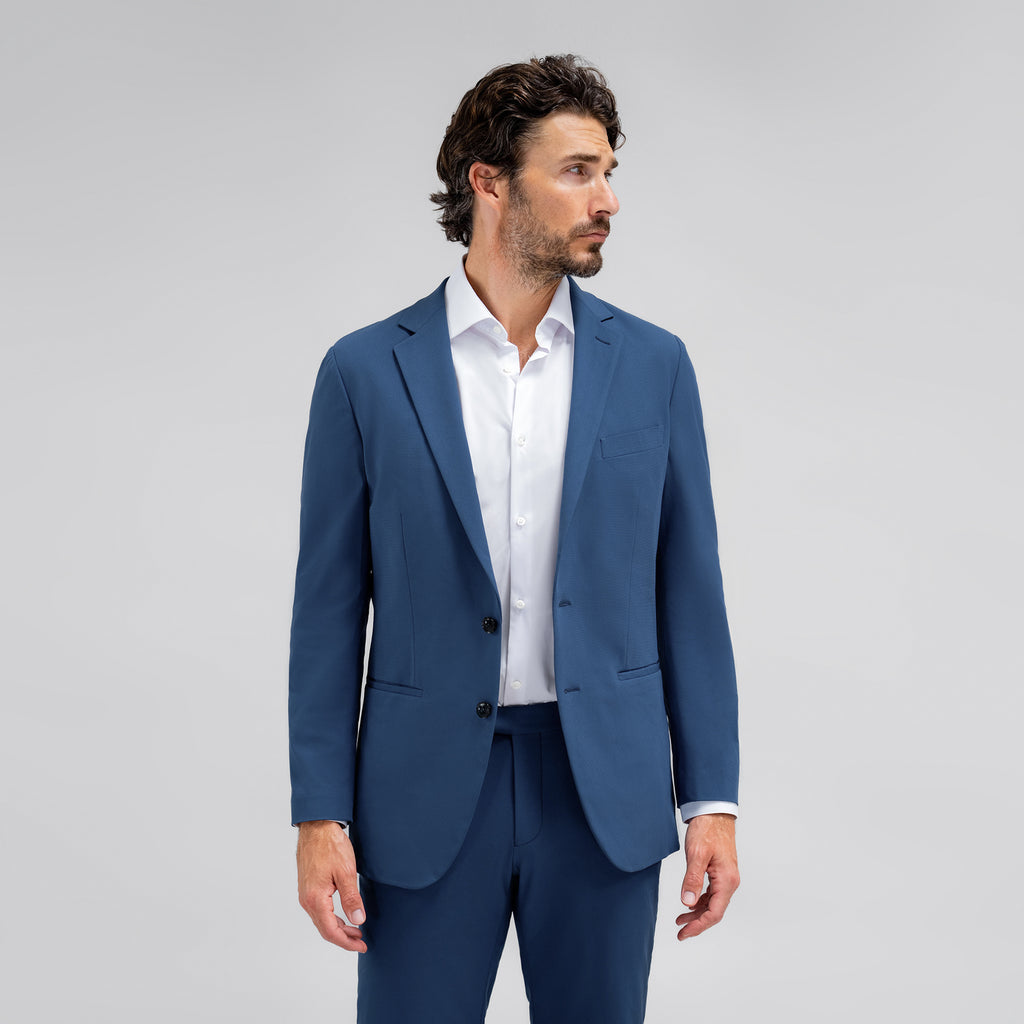 Bespoke custom athleisure technical athletic stretch suit los angeles model John in Italian Blue