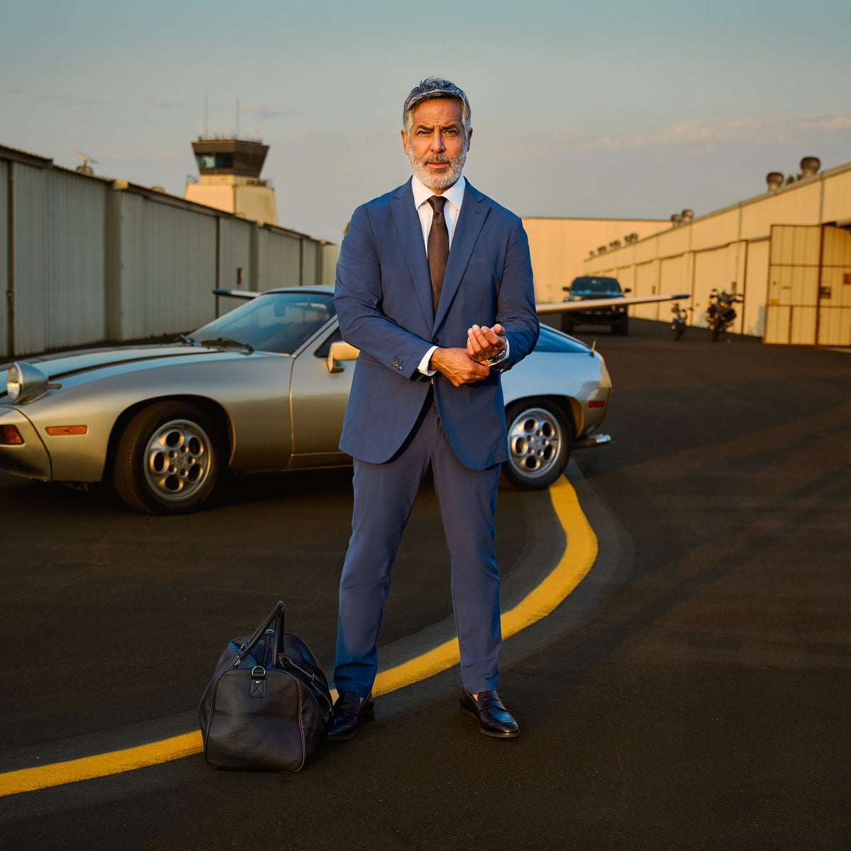 Soho FlexTech trouser in sage, worn with a white shirt and tie