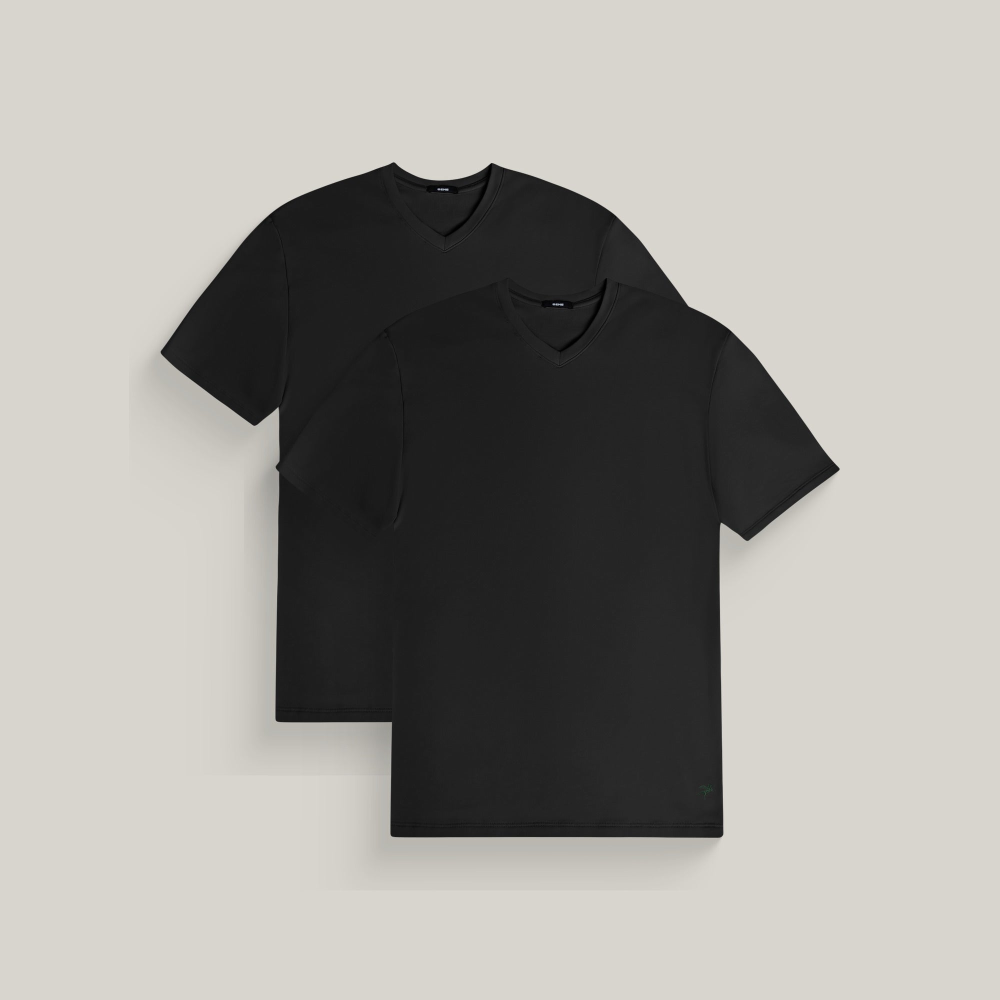 Two v-neck t-shirts in black on a beige background model Tyler in All-Black