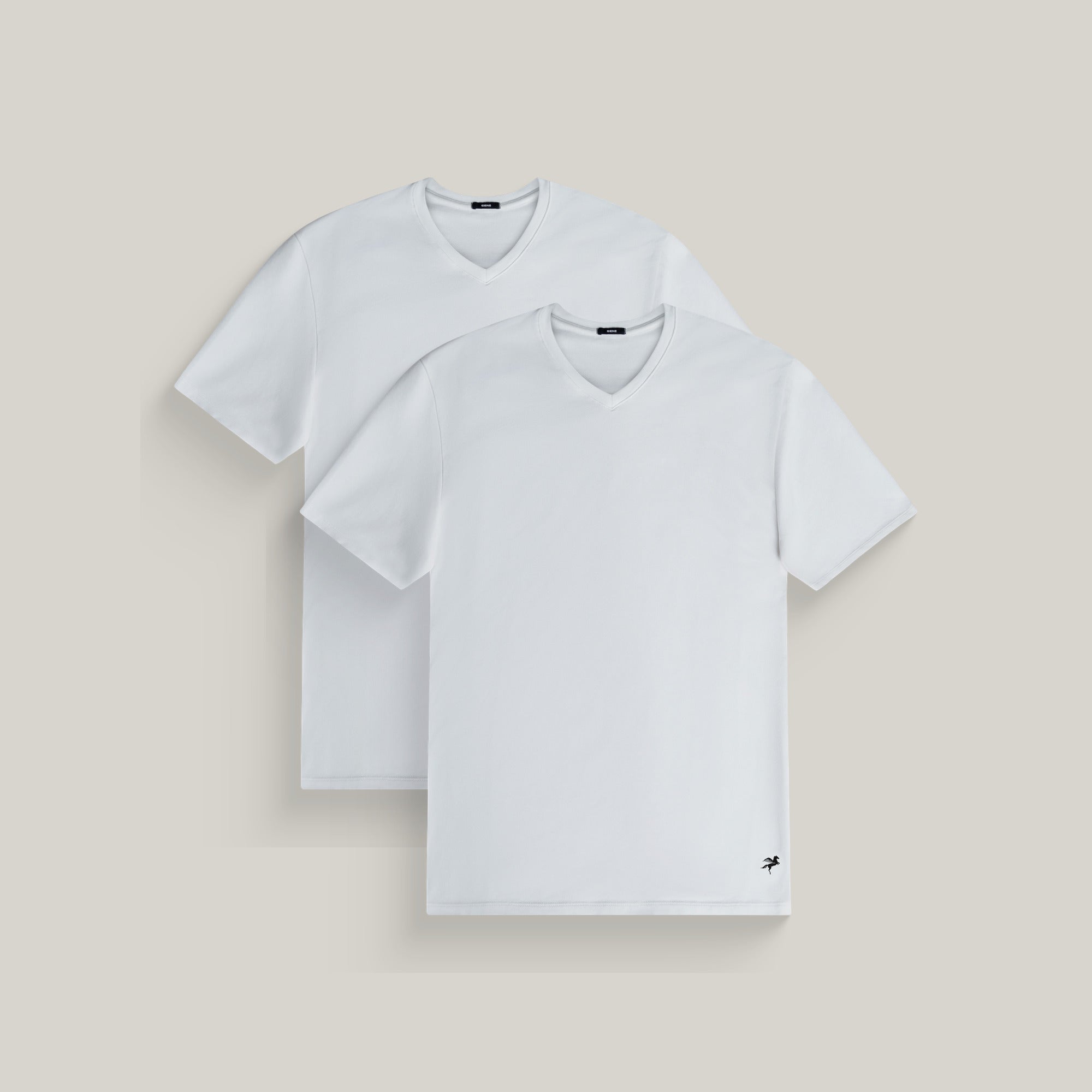 Two v-neck t-shirts in white on a beige background model Tyler in All-White