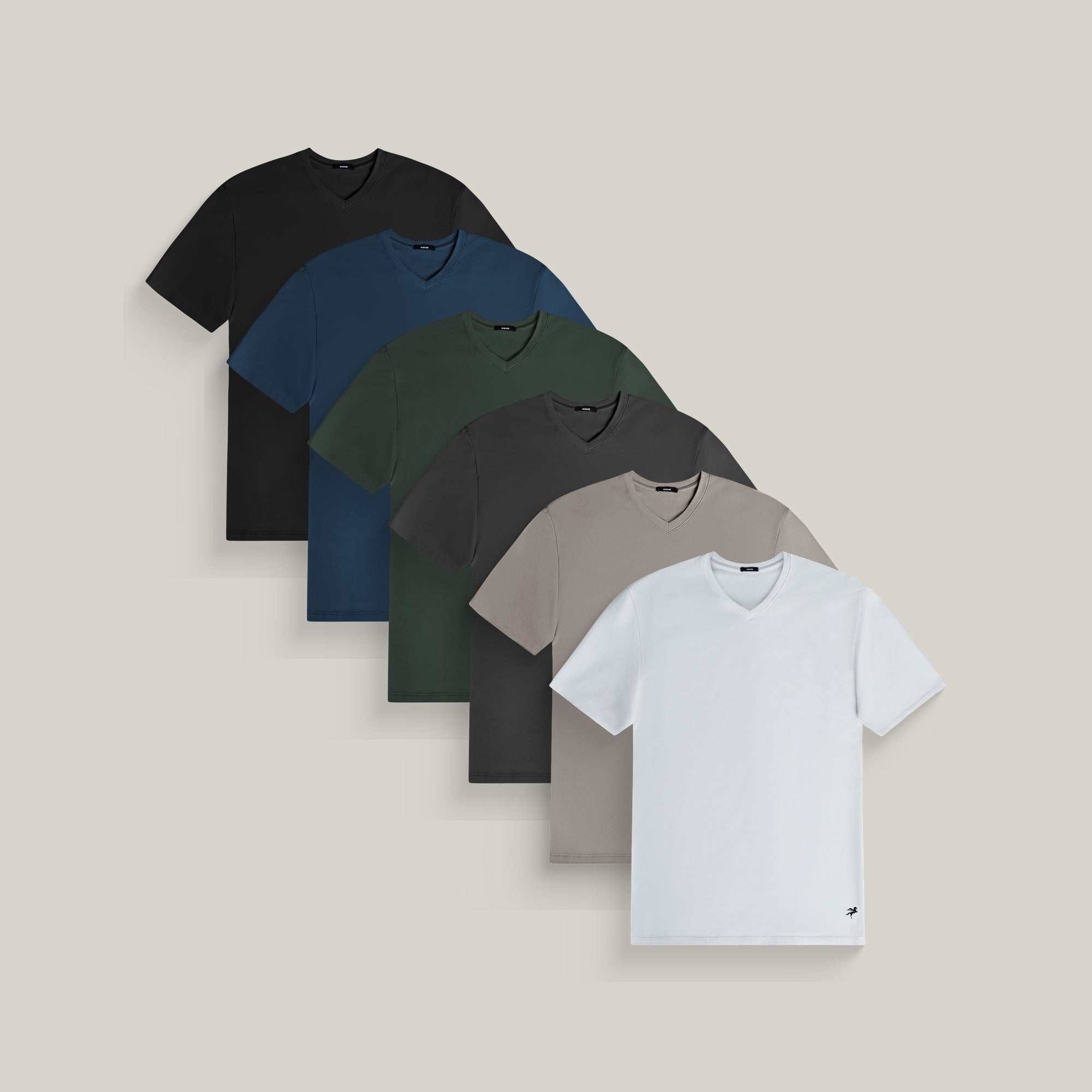 Six v-neck t-shirts in black, deep sea, moss, smoke, frost gray and white on a beige background model Tyler in Best-Seller