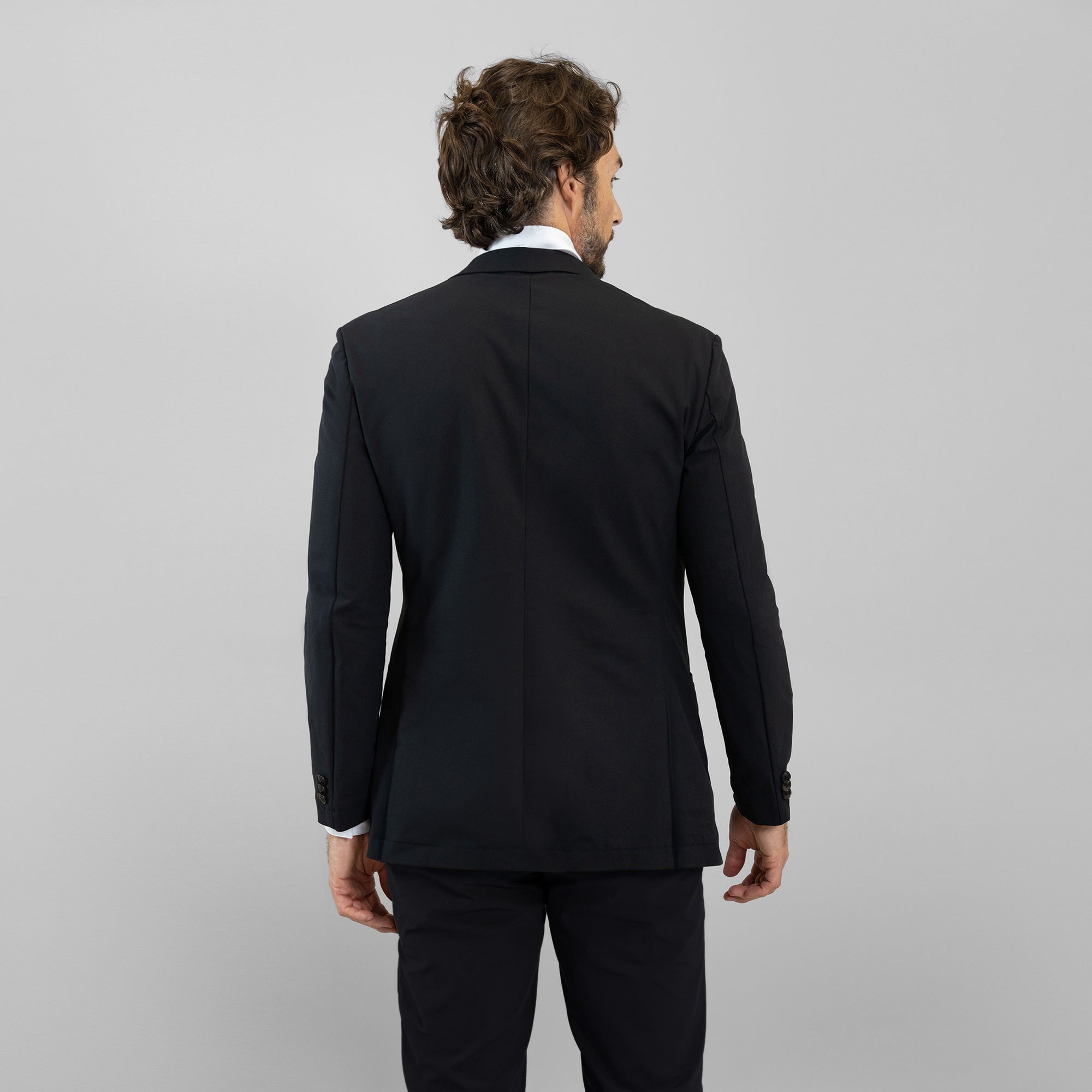 Bespoke custom athleisure technical athletic stretch suit los angeles model John in Black